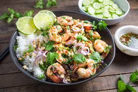 In a large bowl, add shrimp, herbs, and vegetables and drizzle sauce over. Spicy Thai Shrimp Salad With Cilantro Mint And Peanuts Eatcheapandhealthy