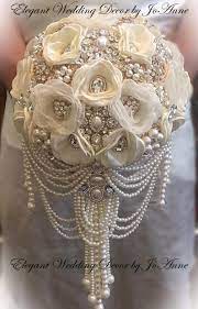 Check out our custom wedding bouquets selection for the very best in unique or custom, handmade pieces from our bouquets shops. Ivory Gold Brooch Bouquet Cascade Pearl Bouquet Pearl Bouquet Ivory Jeweled Bouquet Pearl Wedding Bouquet Deposit Full Price Is 525 Pearl Bouquet Jeweled Bouquet Gold Wedding Bouquets