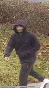 The Greenfield Police Department is trying to identify the person in this  picture that was captured by a residents camera possibly taking packages  off a porch. If you can identify him, please