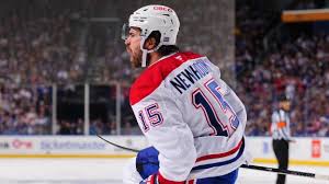 Alex Newhook squeezes in a goal for Montreal