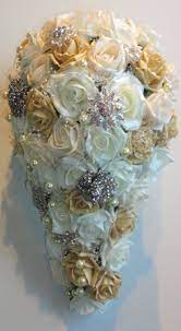Ivory and gold brooch bouquet, bridal bouquet with cascading pearls, ivory fabric flower bouquet, gold bouquet, brooch bouquet, deposit $300.00. Ivory Nude Champagne Fabric Roses Small Teardrop Brides Bouquet Wedding Flowers Blumen Bluten Girlanden