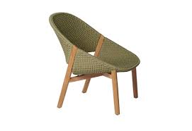 A large, comfortable, upholstered chair. Elio Easy Chair By Tribu Stylepark
