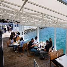 Long-delayed over-the-water restaurant opens at Seaport Village – San Diego  Union-Tribune