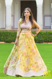 Light Lehengas Yellow And Pink Floral Light Lehenga Wedmegood Yellow Cotton Lehenga With A Cutwork B Lehenga Designs Indian Dresses Indian Bridal Lehenga