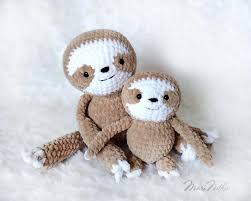 Gift your baby, toddler, or child one of these irresistibly cute sloth stuffed animals. Mother Baby Stuffed Plush Sloths Etsy Crochet Sloth Sloth Plush Sloth Stuffed Animal