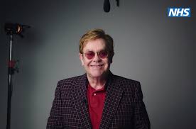 The rocket man 🚀 #eltonjewelbox out now 💎 www.eltonjohnaidsfoundation.org/holiday2020. Elton John Appears In Psa Encouraging Britons To Get Covid 19 Vaccine Billboard