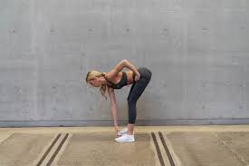 How to do standing alternating toe touches: Camilla Akerberg Shares Her Favourite Do Anywhere Workout