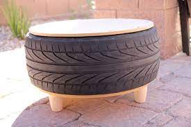 To save money on craft moss, fill tire with bubble wrap, packing peanuts or polyester fiberfill and layer moss on top. Diy Recycled Tire Coffee Table Persia Lou