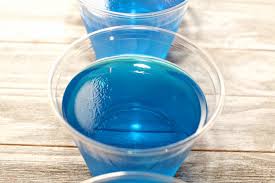 You make this dessert by suspending gummy worms in green jello, letting the jello harden. Day At The Beach Jello Cups Simple And Seasonal