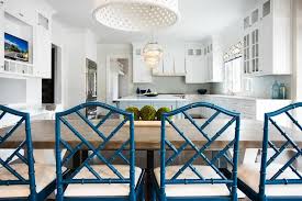 Eat In Kitchen Boasts White Pierced Drum Pendant Hung Over An Iron And Wood Dining Table Seating Bamboo Dining Chairs Painted Dining Chairs Dining Table Chairs