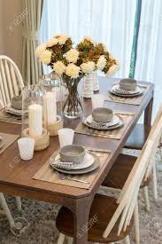 Detail of a dining table set up with wine glasses. Dining Table And Comfortable Chairs In Modern Home With Elegant Stock Photo Picture And Royalty Free Image Image 38593374