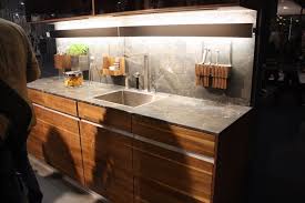 Kitchen remodel with reclaimed wood cabinetry and industrial details. Wood Kitchen Cabinets Just One Way To Feature Natural Material