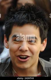 American Idol contestant David Archuleta, and his father, Jeff Archuleta,  smile before a performance at David's high school Friday, May 9, 2008, in  Murray, Utah. (AP Photo/Kenny Crookston Stock Photo