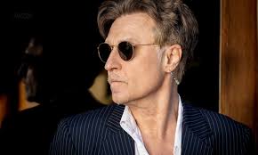 INTERVIEW: JOHN WAITE talks about 'Anything', 'Singles' the new Documentary  'The Hard Way' and turning his hand to writing.