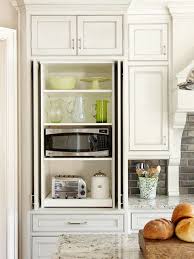 These recessed shelves keep ingredients handy while keeping them away from heat and too much light. Hidden Microwave Cabinet Transitional Kitchen Bhg