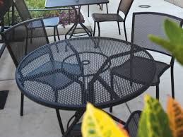 Check out our outdoor tablecloth with umbrella hole selection for the very best in unique or custom, handmade pieces from our table linens shops. Woodard Mesh Wrought Iron Textured Black 48 Wide Round Table With Umbrella Hole Wr280137n 92