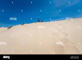 White sand dunes in La Gi, Phan Tiet area in Vietnam. Landscape with blue  sky on the south of Mui Ne Stock Photo - Alamy
