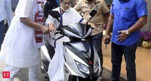 Pm modi's jibe as cm protests fuel price hike. Watch Mamata Banerjee Nearly Falls While Driving Electric Scooter To Protest Fuel Price Hike The Economic Times Video Et Now