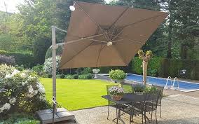 If you're worried that a big lump of plastic is going to make your posh metal or wooden garden furniture look, well, cheap, a cast iron parasol base like this. Parasol Bases And Ground Anchors Solero Garden And Commercial Parasols