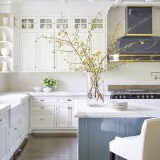 Using traditional overlay cabinetry with a shaker door style from showplace wood works we created a modern kitchen using flat black quartz tops by silestone and a porcelain floor. This Home Proves Updated Traditional Is Here To Stay