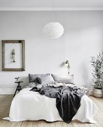 The pale grey walls, the touches of blush pink and all those lovely textures. Grey And White Minimalist Bedroom Novocom Top