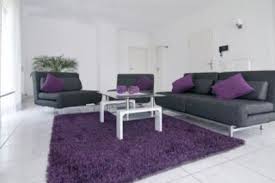 The Main Use Of White And Black With The Accent Of Purple Makes This Room An Exam Purple Living Room Living Room Decor Purple Living Room Ideas Purple And Grey
