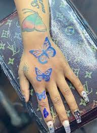 Blue butterfly tattoo on hand instagram. Pin On Daily Dose Of Ink