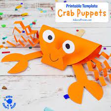 A home office & crafting room for a graphic designer is dominated by a unique lighting fixture. Crab Puppet Craft Kids Craft Room