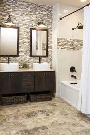 A refined moody bathroom clad with chocolate brown tiles, with chic gold fixtures, a white tub and a niche for storage. 15 Exquisitely Captivating Gray And Brown Bathroom Ideas
