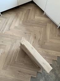 With just an easy sweep and mop the floor is clean enough for kids to crawl on. Herringbone Oak Flooring In The Kitchen Supplied And Fitted Private New Build House In Edinbur Parquet Flooring Kitchen Herringbone Wood Floor House Flooring