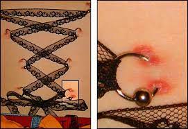 Seriously Wtf Start Doing Corset Piercings Properly The Publisher S Ring Bme Tattoo Piercing And Body Modification News