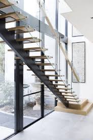 It is a spiral staircase with a vertical railing and complements the white painted deck. How To Select The Right Railing Design