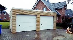 Http Nordland Garagen De Projects Doppelgarage Mit Holzverkleidung Holzverkleidung Doppelgarage Fassade Haus