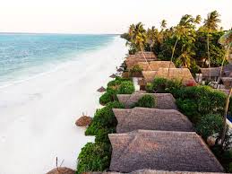Maasai tribesmen in colourful native dress playing football on the beach, paje, zanzibar, tanzania, east africa, africa. Zanzibar Sunrise At Bandas Boutique Hotel Home Page