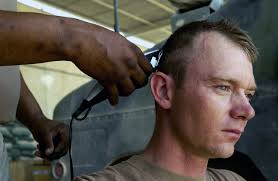 U.S. Army SPEC. Steven Kissick receives a haircut at Camp Hotel, An Najaf  Province, Iraq,
