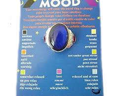 mood ring oval shaped on a card with colour coded chart telling you your inner moods adjustable to fit different size of fingers from spiritual