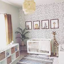 Gender Neutral Jungle Nursery With Animal Cheetah Print Wallpaper And Safari Animal Prints And Boho Accen Baby Room Design Nursery Baby Room Baby Nursery Decor
