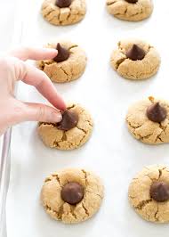 If you are looking for an easy dessert recipe for the holidays be sure to try these christmas sugar cookie cups with hershey's kisses. Quick Easy Peanut Butter Blossoms Chef Savvy