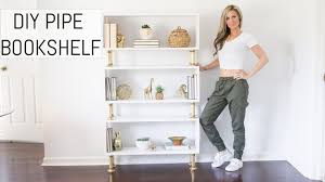 There are a lot of ways to use iron plumber's pipe to make shelves. Diy Pipe Bookshelf With A Modern Glam Spin On Industrial Style Erin Spain