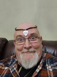 Went to see my grand daughter today and ended up wearing my necklace in  quite a different way. You think it'll catch on?