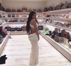 The keeping up with the kardashians star posed in her accessories closet that had $1 million dollars worth of chanel purses and louboutin heels behind her! Kim Kardashian S Handbag Wardrobe Is Truly A Sight To Behold