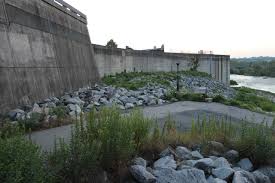 A flood wall (or floodwall) is a primarily vertical artificial barrier designed to temporarily contain the waters of a river or other waterway which may rise to unusual levels during seasonal or extreme weather events. Manchester Floodwall Walk Architecture Richmond