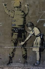 World renowned artist banksy has teamed up with love welcomes to commission refugee women to hand sew mats using life vests found on lesvos beaches. Banksy In Bethlehem Banksy Street Art Bethlehem Palestine The Whole World Is A Playground