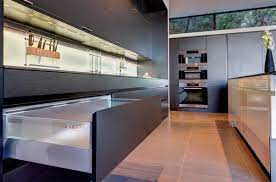 Full overlay doors are attached directly to a sturdy, thick cabinet box, eliminating the need for frames and awkward center stiles. Modern Kitchens Showroom Los Angeles