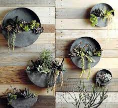 21 best wall mounted planters to infuse your space with greenery metal planter indoor outdoor clay pot holder for