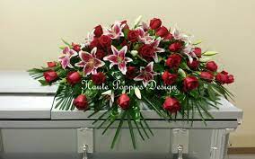 Casket sprays arranged by a local florist, with seasonal flowers. Traditional Stargazer Lily And Red Rose Casket Spray Hautepoppies Com Funeral Floral Arrangements Funeral Floral Funeral Arrangements
