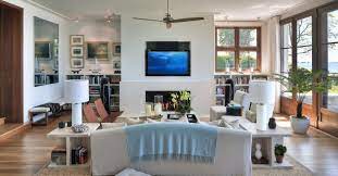 The first thing you need to do when arranging your living room furniture is to figure out where people walk when they are going through the living room arrangements with a fireplace and tv. 10 Rules For Arranging Your Living Room My New Orleans