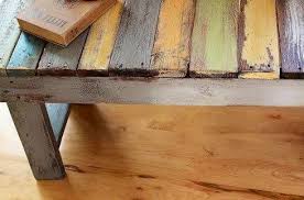 Pallet Wood Coffee Table Top Slats Have Been Painted Multicolored Then Distressed Pallet Diy Wood Pallets Pallet Bench