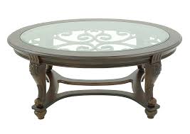 Use the low coffee table on its own or build a complete living room furniture set with the matching cyra end tables, 60w tv stand and console table (coordinating items sold separately). Norcastle Oval Cocktail Table Ivan Smith Furniture