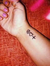 A small tattoo is sure to bring you happiness. Peace Love And Positivity Logic Positivity Tattoo Cool Small Tattoos Peace Tattoos